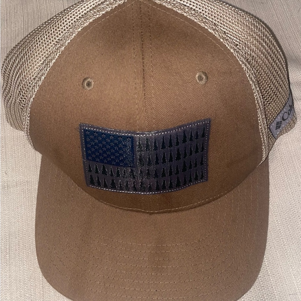 Columbia cap brown American flag in pine trees netted back for air. L/XL fitted